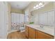 Well-lit bathroom with single sink, vanity, and shower-tub combination at 800 Moratuck Dr # 108, Raleigh, NC 27604