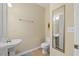 Powder room with single sink and decorative mirror at 800 Moratuck Dr # 108, Raleigh, NC 27604