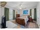 Comfortable bedroom with natural light, ceiling fan, and hardwood floors at 800 Moratuck Dr # 108, Raleigh, NC 27604