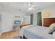 Cozy bedroom features wood floors, ceiling fan, and a comfortable setting at 800 Moratuck Dr # 108, Raleigh, NC 27604