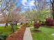 Lush community grounds showcase a variety of trees, shrubs, and manicured green space to be enjoyed by the residents at 800 Moratuck Dr # 108, Raleigh, NC 27604