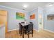 Dining area featuring an artful gallery wall, perfect for entertaining at 800 Moratuck Dr # 108, Raleigh, NC 27604