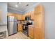 Bright kitchen features stainless steel appliances, granite countertops, and wood cabinets at 800 Moratuck Dr # 108, Raleigh, NC 27604