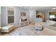 Open-concept living area featuring hardwood floors and access to the kitchen at 800 Moratuck Dr # 108, Raleigh, NC 27604
