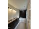 Bathroom with modern tub, vanity, and stylish tile at 801 N Elm St, Durham, NC 27701