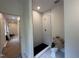 Modern bathroom with new black and white tile in the walk-in shower at 801 N Elm St, Durham, NC 27701