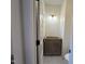 Cozy half-bathroom with custom vanity and decorative lighting at 801 N Elm St, Durham, NC 27701