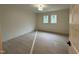 Bright bedroom featuring light wood floors, a ceiling light, and a double window that allows for natural light at 801 N Elm St, Durham, NC 27701
