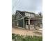 Two-story home with dark green siding, a front porch, and multiple windows, providing ample natural light at 801 N Elm St, Durham, NC 27701