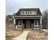 Charming craftsman-style home featuring a covered front porch and inviting curb appeal at 801 N Elm St, Durham, NC 27701