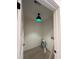 Laundry room with modern light fixture, ample space, and hardwood floors at 801 N Elm St, Durham, NC 27701