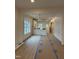 Bright, open-concept living space with hardwood flooring and modern light fixture at 801 N Elm St, Durham, NC 27701