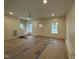 Spacious living room with hardwood floors, neutral paint and lots of natural light at 801 N Elm St, Durham, NC 27701