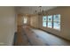 Bright, open-concept living space with hardwood flooring and modern light fixture at 801 N Elm St, Durham, NC 27701
