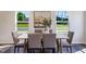Inviting dining room with natural light and stylish furnishings for memorable meals at 804 Windmill Palm Dr, Zebulon, NC 27597