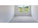 Bedroom featuring carpet flooring, neutral paint, and a view of the playground at 812 Windmill Palm Dr, Zebulon, NC 27597