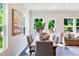 Bright dining room with a contemporary table and chairs, adjacent to a living area, creating a harmonious and inviting space at 812 Windmill Palm Dr, Zebulon, NC 27597