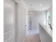 Upstairs hallway with carpet, neutral paint, and natural light at 812 Windmill Palm Dr, Zebulon, NC 27597