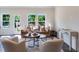 Inviting living room filled with natural light boasts stylish furniture and neutral tones, creating a cozy and elegant atmosphere at 812 Windmill Palm Dr, Zebulon, NC 27597