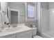 Clean bathroom featuring a white sink, toilet, bathtub, and a framed window at 8925 Hopkins Knob Ct, Zebulon, NC 27597