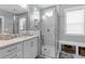 Modern bathroom with a glass enclosed shower, white marble and granite countertops at 8925 Hopkins Knob Ct, Zebulon, NC 27597