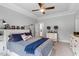 Cozy bedroom featuring a ceiling fan, neutral walls, and bed with storage underneath at 8925 Hopkins Knob Ct, Zebulon, NC 27597
