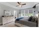 Spacious bedroom featuring neutral tones, a ceiling fan, and a window with natural light at 8925 Hopkins Knob Ct, Zebulon, NC 27597