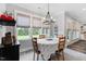 Inviting dining area with plenty of natural light, comfortable seating, and backyard views perfect for Gathering gatherings at 8925 Hopkins Knob Ct, Zebulon, NC 27597