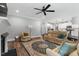 Cozy living room features a fireplace, comfortable seating, and an open layout connecting to the modern kitchen at 8925 Hopkins Knob Ct, Zebulon, NC 27597