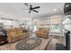 Spacious living room boasts a fireplace, abundant windows, and comfortable seating for a warm and inviting atmosphere at 8925 Hopkins Knob Ct, Zebulon, NC 27597