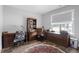 Cozy office with built-in desk, natural light, and comfortable work space at 8925 Hopkins Knob Ct, Zebulon, NC 27597