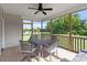 Screened-in porch featuring natural light and wooden decking overlooking the lawn at 8925 Hopkins Knob Ct, Zebulon, NC 27597