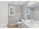 Well-lit bathroom features a single sink vanity and a window with green views at 912 Sethcreek Dr, Fuquay Varina, NC 27526