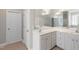 Bathroom featuring dual sinks, tile floor, and large mirror at 912 Sethcreek Dr, Fuquay Varina, NC 27526