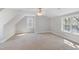 Bright bedroom with neutral walls, carpet, and windows offering plenty of natural light at 912 Sethcreek Dr, Fuquay Varina, NC 27526