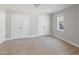 Carpeted bedroom with closet and window with natural light at 912 Sethcreek Dr, Fuquay Varina, NC 27526