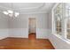 Dining room featuring hardwood flooring, wainscotting and a view into the entryway at 912 Sethcreek Dr, Fuquay Varina, NC 27526
