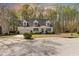 Charming home with dormer windows, well-manicured landscaping, and a circular driveway at 912 Sethcreek Dr, Fuquay Varina, NC 27526