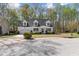 Charming white home featuring dormer windows, a front porch, and a well-manicured front yard at 912 Sethcreek Dr, Fuquay Varina, NC 27526