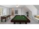 Spacious game room with a foosball table, pool table, and ample space for entertaining at 912 Sethcreek Dr, Fuquay Varina, NC 27526