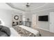 Spacious main bedroom with ceiling fan, sitting area, and en suite bathroom at 912 Sethcreek Dr, Fuquay Varina, NC 27526