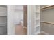 Walk-in closet with built-in shelves and access to the bathroom at 912 Sethcreek Dr, Fuquay Varina, NC 27526