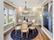 Dining room with a round table, chandelier, and stylish decor in a neutrally painted space at 929 Thimbleweed Way, Wake Forest, NC 27587