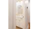 Bathroom featuring white cabinets, stylish gold hardware, arched mirror and decorative tile flooring at 1008 North St, Durham, NC 27701