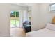 Cozy bedroom featuring a sleeper sofa and access to the fenced backyard at 1008 North St, Durham, NC 27701