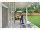 Outdoor patio with large windows overlooking private fenced backyard at 1008 North St, Durham, NC 27701
