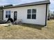 A backyard of a home with a small sitting area and grill at 11 Balboa Pkwy, Clayton, NC 27520