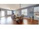 Open floor plan dining room featuring lots of natural light and hardwood floors at 11 Balboa Pkwy, Clayton, NC 27520