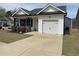 Traditional-style home showcasing a one-car garage and driveway at 11 Balboa Pkwy, Clayton, NC 27520
