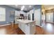 Modern kitchen featuring a center island, stainless steel appliances, and white cabinetry for a bright and inviting space at 11 Balboa Pkwy, Clayton, NC 27520